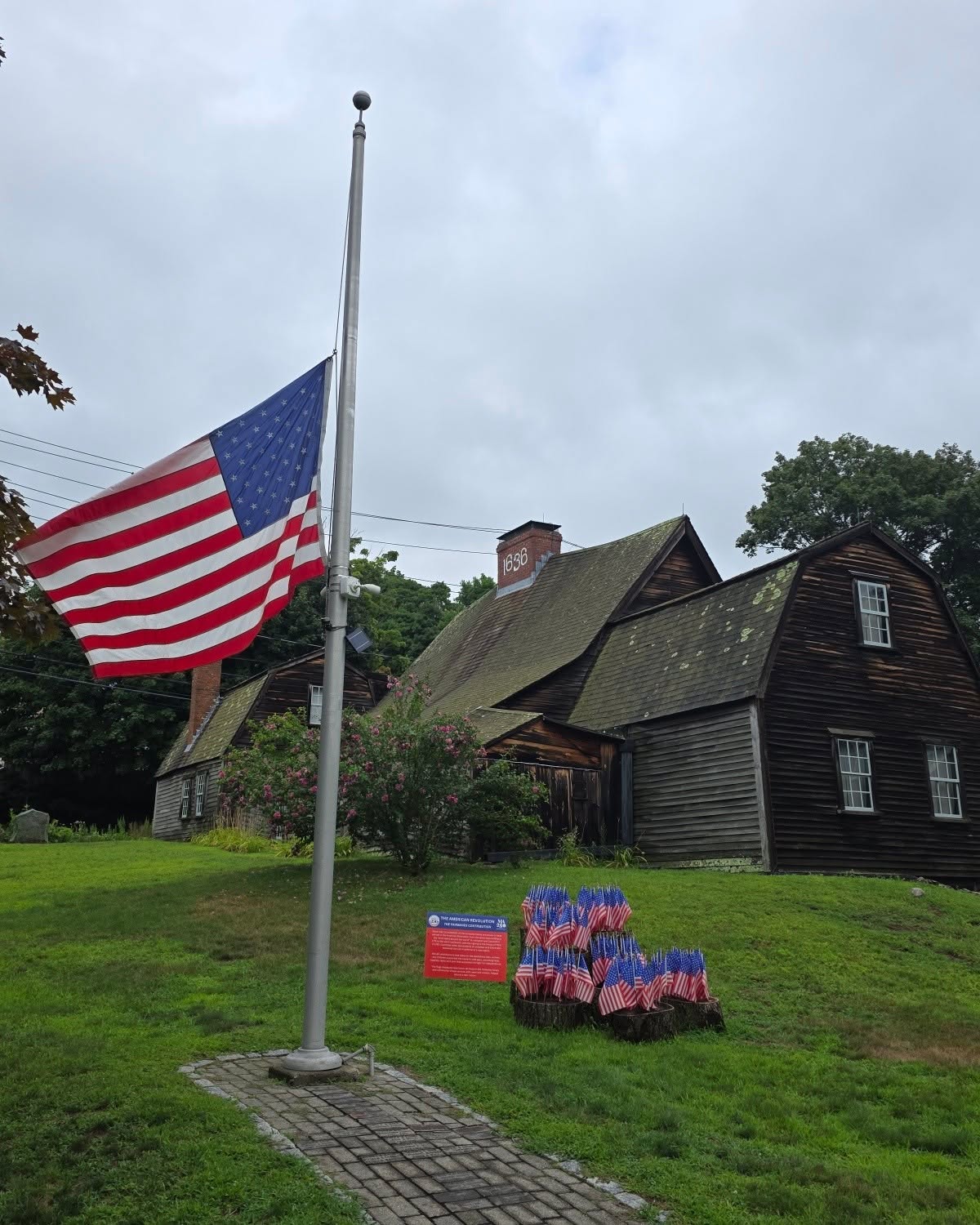 The American flag lowered to half-staff at the Fairbanks Homestead